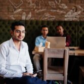 group-four-south-asian-men-s-posed-business-meeting-cafe-indians-work-with-laptops-together-using-various-gadgets-having-conversation-indian-man-with-mobile-phone_627829-5227